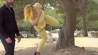 Public lady suspension bondage exposed with buttplug in behind