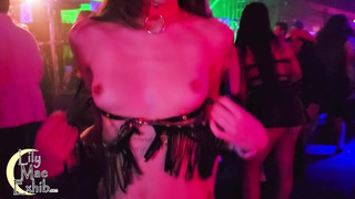 Boobies out on the dancefloor at a packed night club!