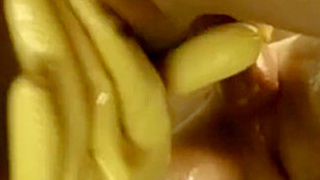 With Milf Doing A Bizarre Hand-Job While Wearing Rubber