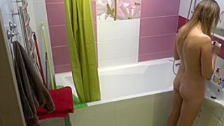 My blonde ex-gf doing her makeup nude in the bathroom