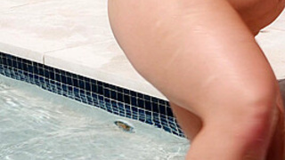 Kira Gives A Wet T-Shirt Show In A Pool Before Spreading Her Snatch And Finger-Fucking Her Slit In Doggie-Style.
