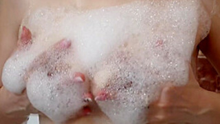 hairy bush mature takes a soapy shower