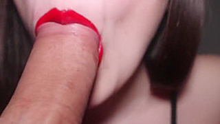 Brunette With Red Lipstick Sucking A Big Cock