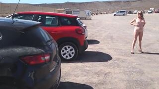 Naked pissing in beach car park