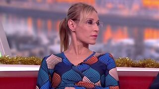 Long legged tv host in ebony pantyhose and heels one