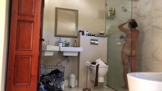 Hairy ex-wife showing her naked body washing her hair