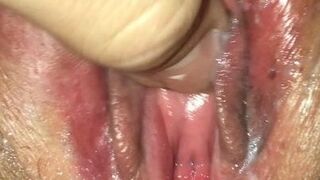 Playing with her wet cunt and clit.